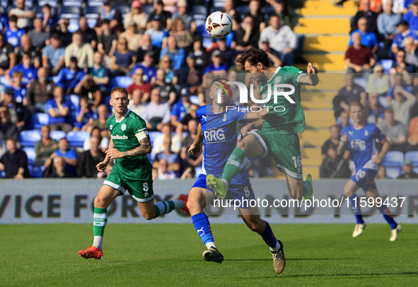 Josh Lundstram of Oldham Athletic Association Football Club tussles with Sonny Blu Lo-Everton of Yeovil Town Football Club during the Vanara...