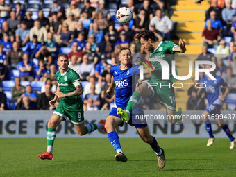 Josh Lundstram of Oldham Athletic Association Football Club tussles with Sonny Blu Lo-Everton of Yeovil Town Football Club during the Vanara...