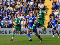 Josh Lundstram of Oldham Athletic Association Football Club tussles with Sonny Blu Lo-Everton of Yeovil Town Football Club during the Vanara...