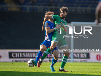 Yeovil Town's Aaron Jarvis battles for possession during the Vanarama National League match between Oldham Athletic and Yeovil Town at Bound...