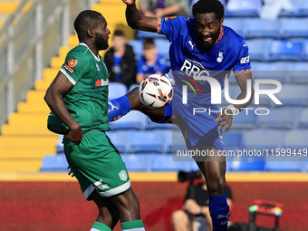 Emmanuel Monthe of Oldham Athletic Association Football Club tussles with Frank Nouble of Yeovil Town Football Club during the Vanarama Nati...