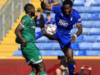 Emmanuel Monthe of Oldham Athletic Association Football Club tussles with Frank Nouble of Yeovil Town Football Club during the Vanarama Nati...