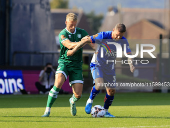 James Norwood of Oldham Athletic Association Football Club tussles with Jake Wannell of Yeovil Town Football Club during the Vanarama Nation...