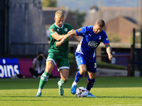 James Norwood of Oldham Athletic Association Football Club tussles with Jake Wannell of Yeovil Town Football Club during the Vanarama Nation...