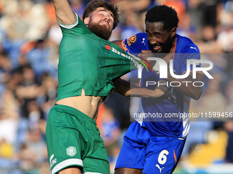 Emmanuel Monthe of Oldham Athletic Association Football Club tussles with Aaron Jarvis of Yeovil Town Football Club during the Vanarama Nati...