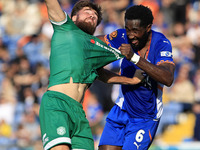 Emmanuel Monthe of Oldham Athletic Association Football Club tussles with Aaron Jarvis of Yeovil Town Football Club during the Vanarama Nati...