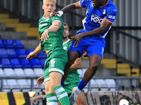 Mike Fondop of Oldham Athletic Association Football Club tussles with Jake Wannell of Yeovil Town Football Club during the Vanarama National...