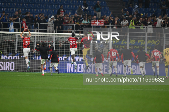 The team of AC Milan celebrates after victory during the Italian Serie A football match between Inter FC and AC Milan in Milan, Italy, on Se...