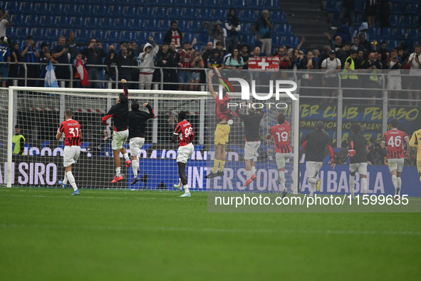 The team of AC Milan celebrates after victory during the Italian Serie A football match between Inter FC and AC Milan in Milan, Italy, on Se...