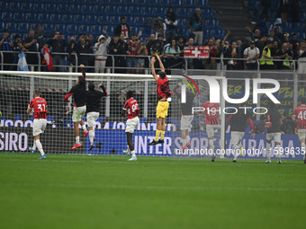 The team of AC Milan celebrates after victory during the Italian Serie A football match between Inter FC and AC Milan in Milan, Italy, on Se...