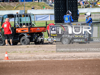 The SC18 crew is taken back to the pits on the recovery vehicle during the FIM Long Track World Championship Final 5 at the Speed Centre Rod...