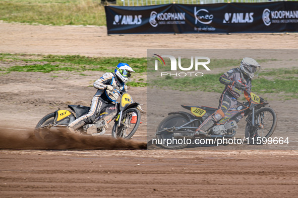 Zach Wajtknecht (109) of Great Britain in white leads Henri Ahlbom (97) of Finland in blue during the FIM Long Track World Championship Fina...