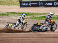 Zach Wajtknecht (109) of Great Britain in white leads Henri Ahlbom (97) of Finland in blue during the FIM Long Track World Championship Fina...