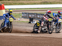 Kenneth Kruse Hansen (333) of Denmark in white rides outside Chris Harris (37) of Great Britain in red with Jordan Dubernard (85) of France...