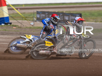 Kenneth Kruse Hansen (333) of Denmark in white leads Chris Harris (37) of Great Britain in red during the FIM Long Track World Championship...