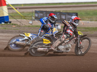 Kenneth Kruse Hansen (333) of Denmark in white leads Chris Harris (37) of Great Britain in red during the FIM Long Track World Championship...