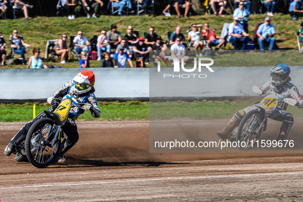 Henri Ahlbom (97) of Finland in red leads Andrew Appleton (141) of Great Britain in blue during the FIM Long Track World Championship Final...