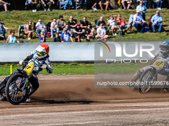 Henri Ahlbom (97) of Finland in red leads Andrew Appleton (141) of Great Britain in blue during the FIM Long Track World Championship Final...