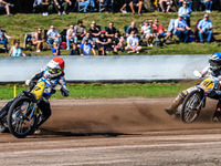 Henri Ahlbom (97) of Finland in red leads Andrew Appleton (141) of Great Britain in blue during the FIM Long Track World Championship Final...