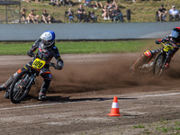 Zach Wajtknecht (109) of Great Britain in blue leads Lukas Fienhage (125) of Germany in red during the FIM Long Track World Championship Fin...