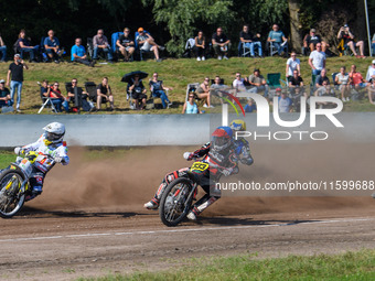 Kenneth Kruse Hansen (333) of Denmark in blue rides inside Martin Smolinski (84) of Germany in white, Hynek Stichauer (86) of Czech Republic...