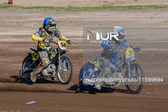 Chris Harris (37) of Great Britain in white leads Mika Meijer (54) of The Netherlands in blue during the FIM Long Track World Championship F...