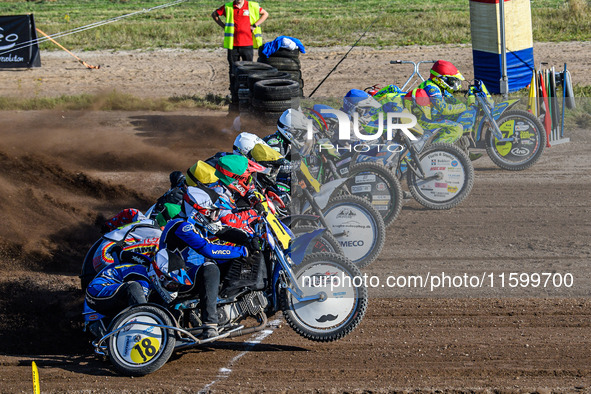 Sidecar Final: (L to R) Kenny Van Eeckhout & Axelle Cannaerts (18) of Belgium in Black & White, Clement & Romain Furet (32) of France in Gre...