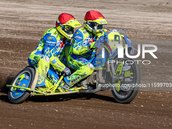 Mitch Goddard and Paul Smith (9) of Great Britain lead the sidecar final in the Sidecar Support Class during the FIM Long Track World Champi...