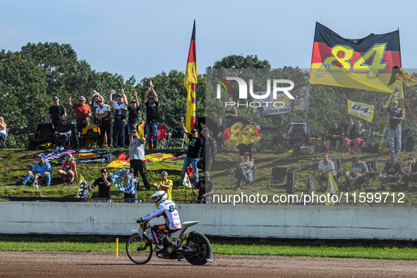 Martin Smolinski (84) of Germany rides past his fans after his heat during the FIM Long Track World Championship Final 5 at the Speed Centre...