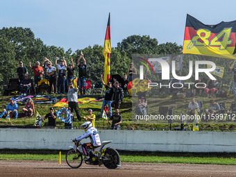 Martin Smolinski (84) of Germany rides past his fans after his heat during the FIM Long Track World Championship Final 5 at the Speed Centre...