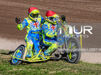 Mitch Goddard and Paul Smith (9) of Great Britain take their lap of honor in the Sidecar Support Class during the FIM Long Track World Champ...