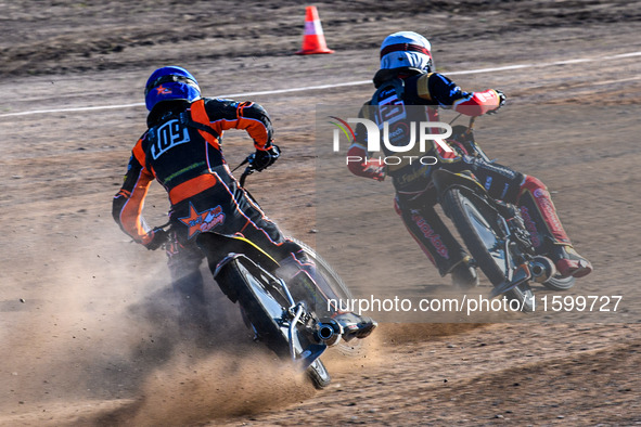 Zach Wajtknecht (109) of Great Britain in blue chases Lukas Fienhage (125) of Germany in white during the FIM Long Track World Championship...