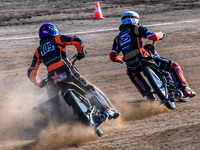 Zach Wajtknecht (109) of Great Britain in blue chases Lukas Fienhage (125) of Germany in white during the FIM Long Track World Championship...