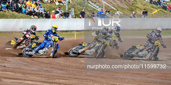 Zach Wajtknecht (109) of Great Britain in red rides inside Mika Meijer (54) of The Netherlands in white and Jordan Dubernard (85) of France...