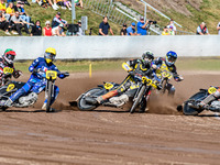 Zach Wajtknecht (109) of Great Britain in red rides inside Mika Meijer (54) of The Netherlands in white and Jordan Dubernard (85) of France...