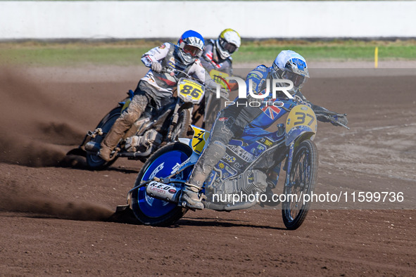 Chris Harris (37) of Great Britain in white leads Hynek Stichauer (86) of the Czech Republic in blue and Zach Wajtknecht (109) of Great Brit...