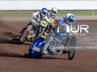 Chris Harris (37) of Great Britain in white leads Hynek Stichauer (86) of the Czech Republic in blue and Zach Wajtknecht (109) of Great Brit...