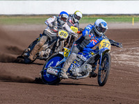 Chris Harris (37) of Great Britain in white leads Hynek Stichauer (86) of the Czech Republic in blue and Zach Wajtknecht (109) of Great Brit...