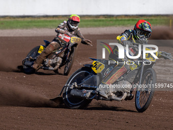 Mika Meijer (54) of The Netherlands in red leads Kenneth Kruse Hansen (333) of Denmark in yellow during the FIM Long Track World Championshi...