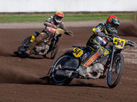 Mika Meijer (54) of The Netherlands in red leads Kenneth Kruse Hansen (333) of Denmark in yellow during the FIM Long Track World Championshi...