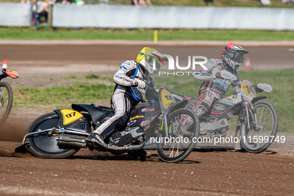 Henri Ahlbom (97) of Finland in Yellow rides outside Andrew Appleton (141) of Great Britain in Red during the FIM Long Track World Champions...