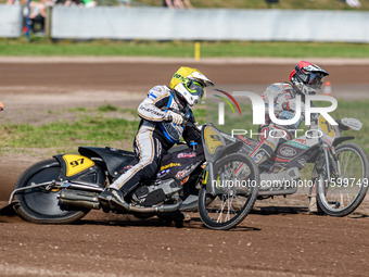 Henri Ahlbom (97) of Finland in Yellow rides outside Andrew Appleton (141) of Great Britain in Red during the FIM Long Track World Champions...