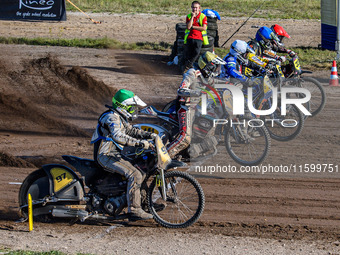 Start of the last chance heat: (L to R) Henri Ahlbom (97) of Finland in Green, Andrew Appleton (141) of Great Britain in Yellow, Chris Harri...