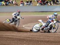 Martin Smolinski (84) of Germany in blue leads Hynek Stichauer (86) of the Czech Republic in red during the FIM Long Track World Championshi...