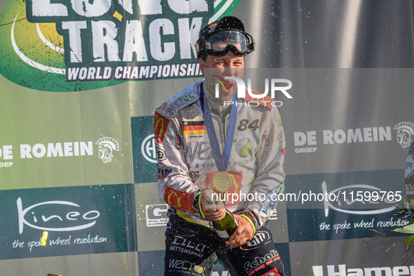 Martin Smolinski (84) of Germany sprays the Champagne during the FIM Long Track World Championship Final 5 at the Speed Centre Roden in Rode...