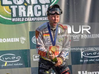 Martin Smolinski (84) of Germany sprays the Champagne during the FIM Long Track World Championship Final 5 at the Speed Centre Roden in Rode...