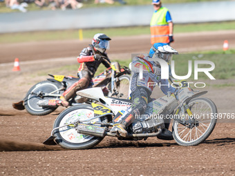 Martin Smolinski (84) of Germany in blue leads Lukas Fienhage (125) of Germany in white during the FIM Long Track World Championship Final 5...