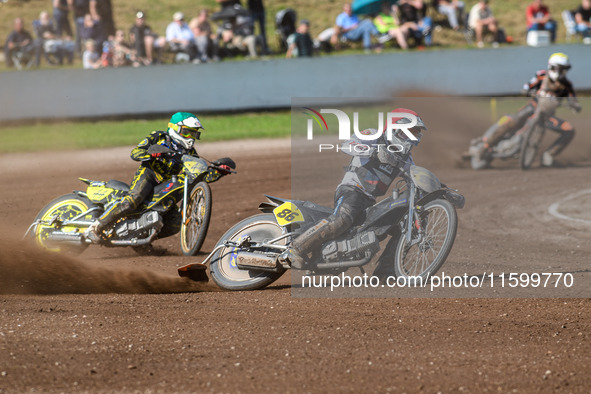 Hynek Stichauer (86) of the Czech Republic in red leads Tero Aarnio (44) of Finland in green during the FIM Long Track World Championship Fi...