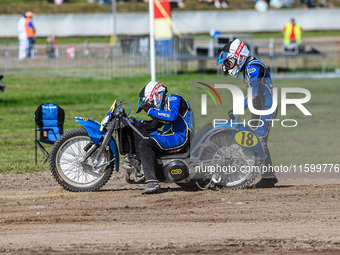 Kenny Van Eeckhout and Axelle Cannaerts of Belgium suffer mechanical difficulties in the Sidecar Support Class during the FIM Long Track Wor...