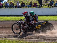 Kenneth Kruse Hansen (333) of Denmark in red rides inside Lukas Fienhage (125) of Germany in green during the FIM Long Track World Champions...